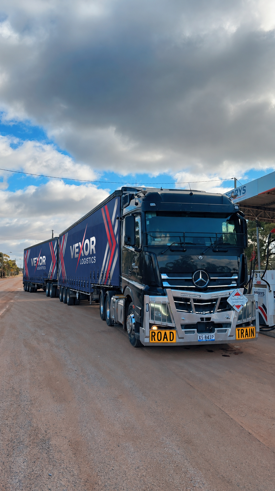 A Vexor Logistics prime mover and trailers on the open highway during an East-West interstate run
