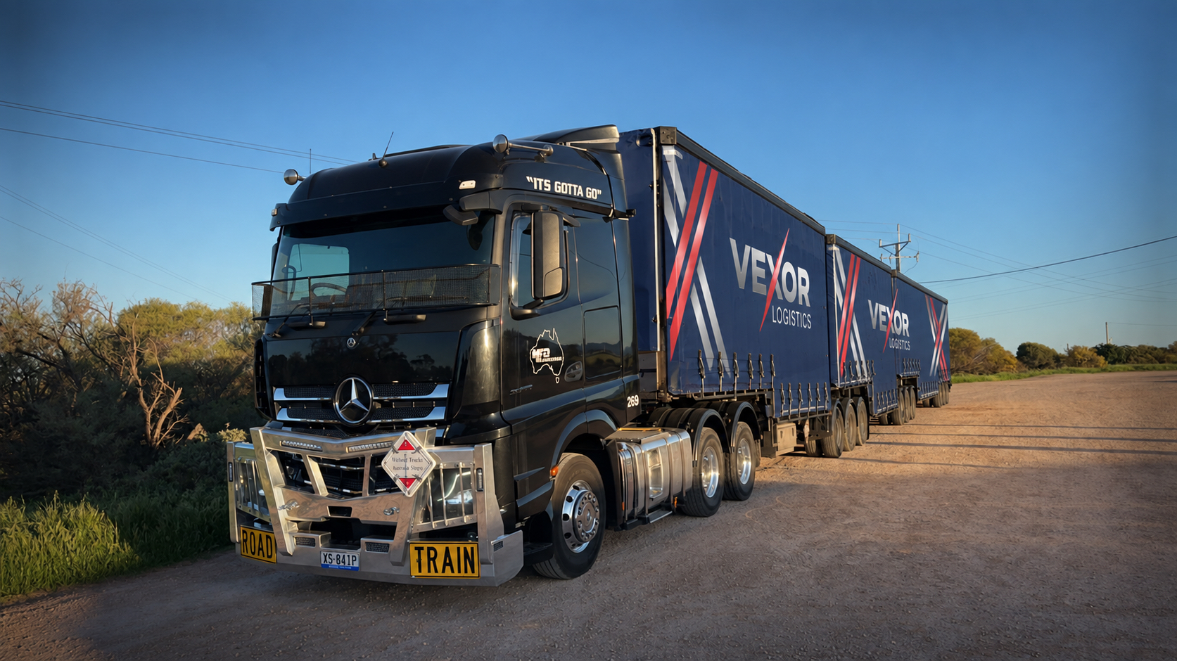 A Vexor Logistics driver checking the load and equipment during a long-haul interstate journey